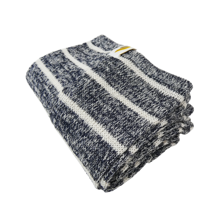 Folded gray and white striped leg warmer on a light gray background