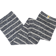 Pair of gray and white striped leg warmers on a light gray background