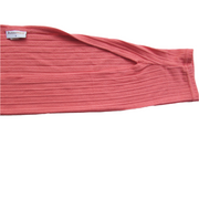 Pink ribbed fabric with a brand label on a white background